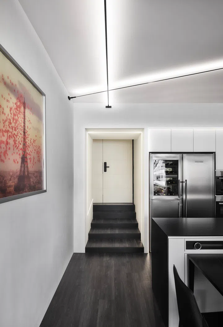 Split levels, a hallmark of 1980s apartments, are retained and refined with lighting to highlight their sculptural quality.