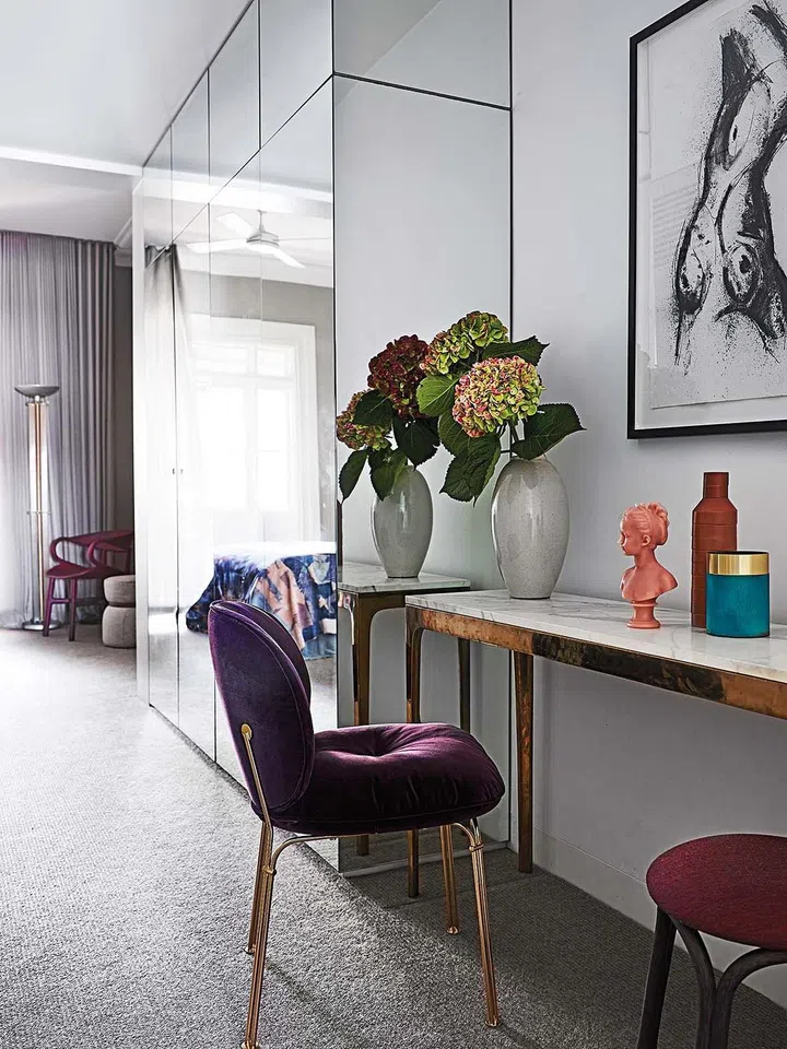 A console adds interesting detail in the mostly open-concept spaces.