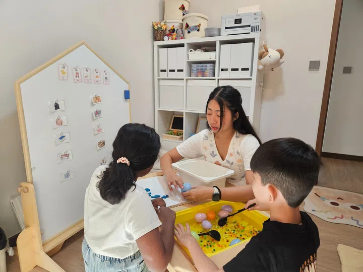 Denise teaching special needs children in her home.