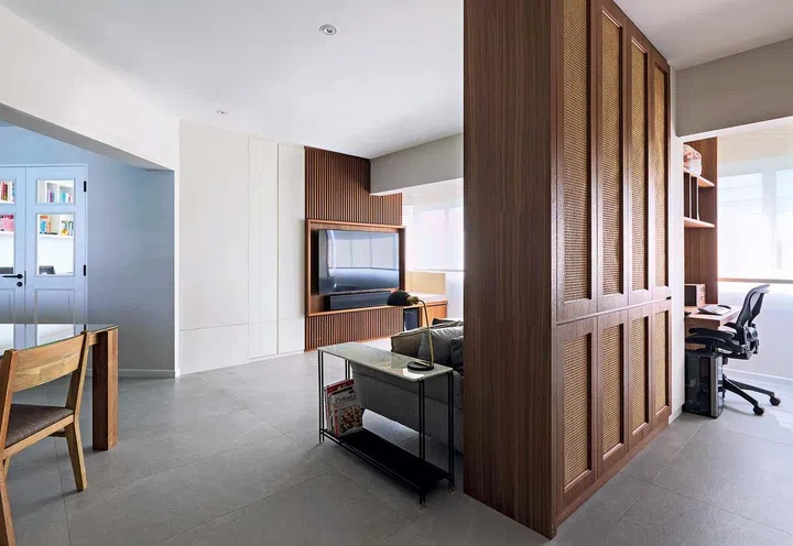 The details of the cabinetry help to balance out the glaring presence of the odd-angled beams, making the open living area feel cosy and intimate.
