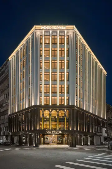 Night time facade of the OKU Hotel Taichung, a revitalised former Sakurada Department Store decked in French Art Deco elegance.
