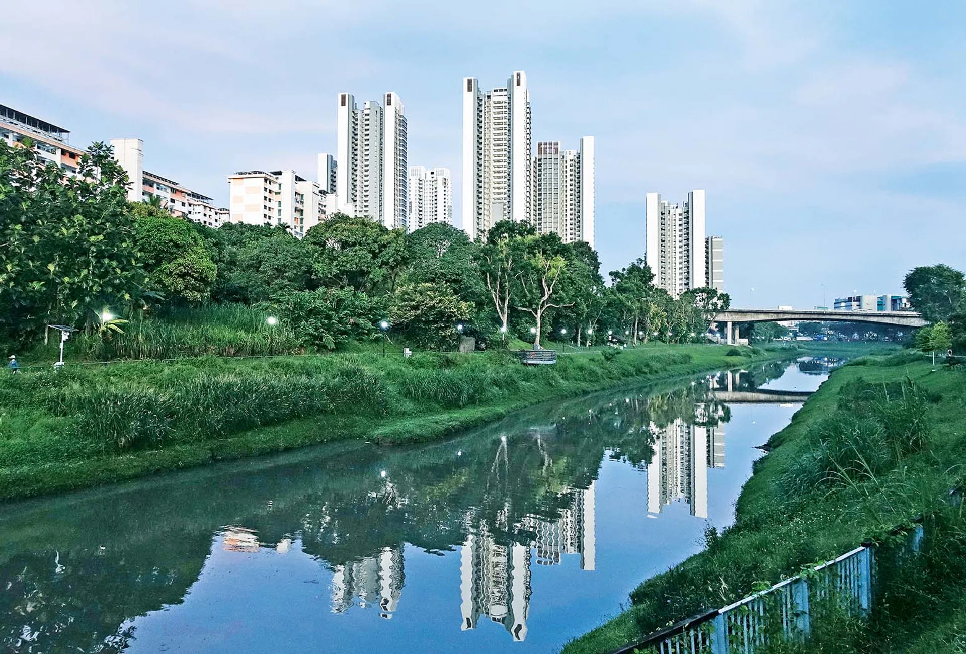 The new Clementi NorthArc HDB flats (tall buildings) are seen reflected in the Sungei Ulu Pandan canal on May 4, 2023.