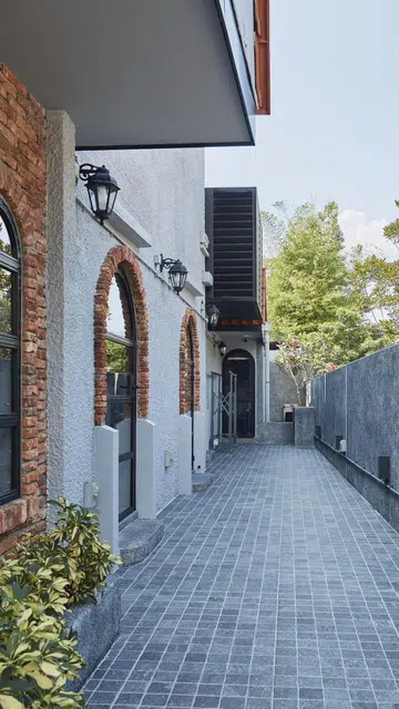 Malaccan bricks featured on the façade of this 1,189 sq ft single-storey corner terrace house in Siglap.