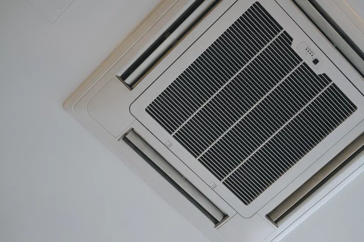 An overhead view capturing the sleek design of a modern cassette air conditioning unit.