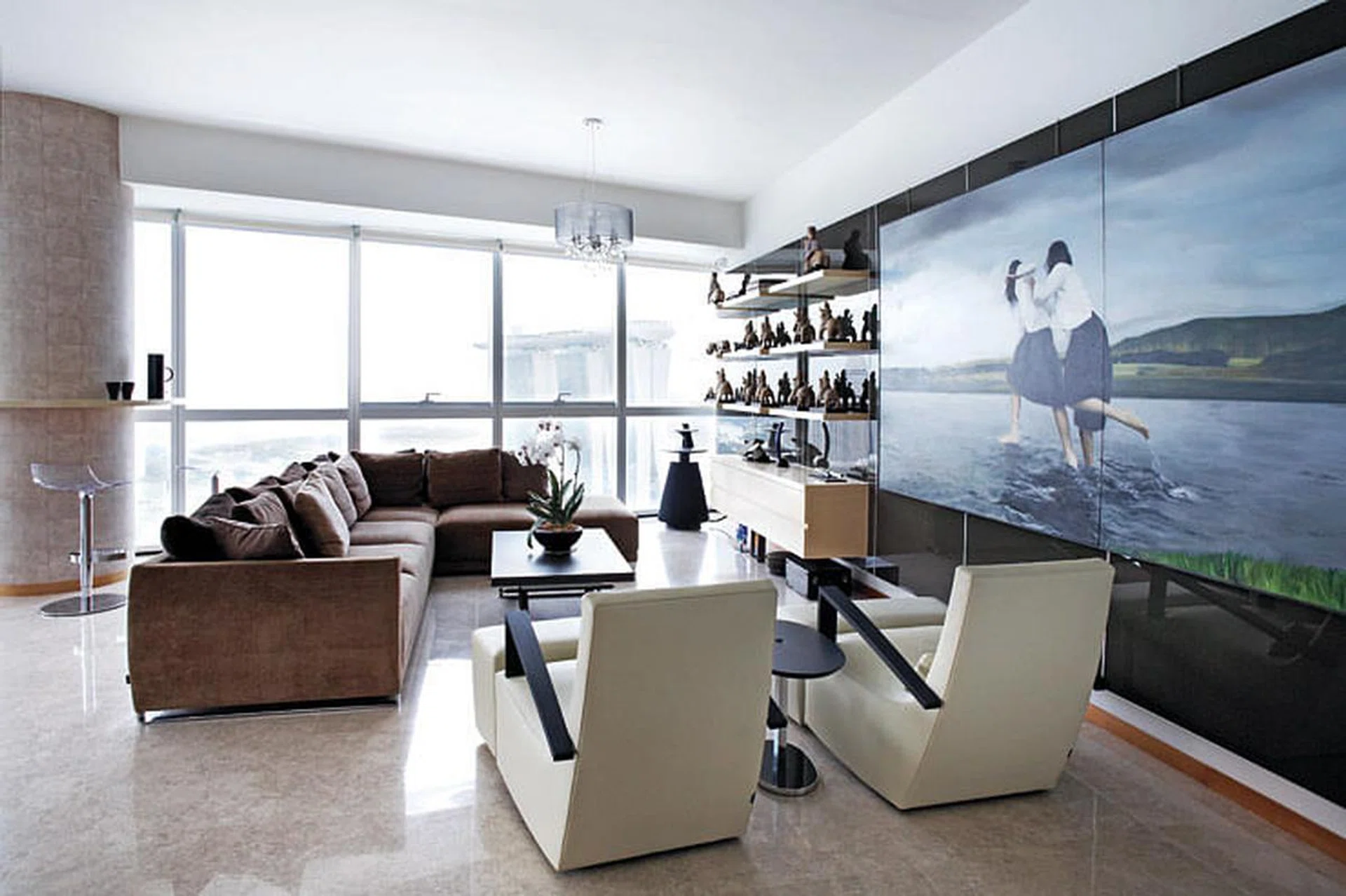European furniture – Ligne Roset from France and Calligaris from Italy – are paired with contemporary Chinese art for a cosmopolitan look. Flask and tumblers, from The Touch in this expat couple's 4-bedroom condominium in Marina Bay Residences.