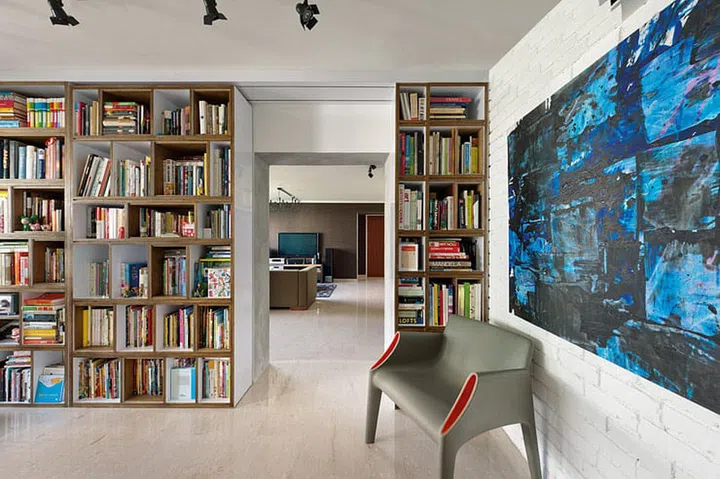 Despite the amount of books on the shelves, this shelving unit doesn't look bulky as the shelves go from floor the ceiling, maximising every inch of space!