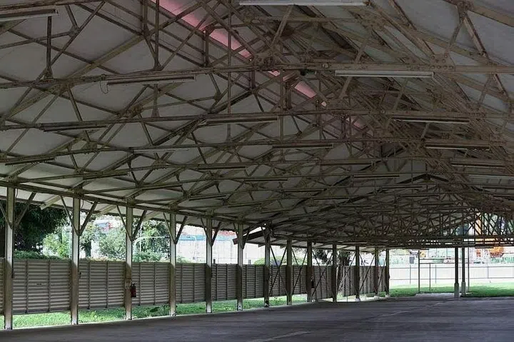 The old drill shed was designed as an outdoor training space with a metal roof structure.