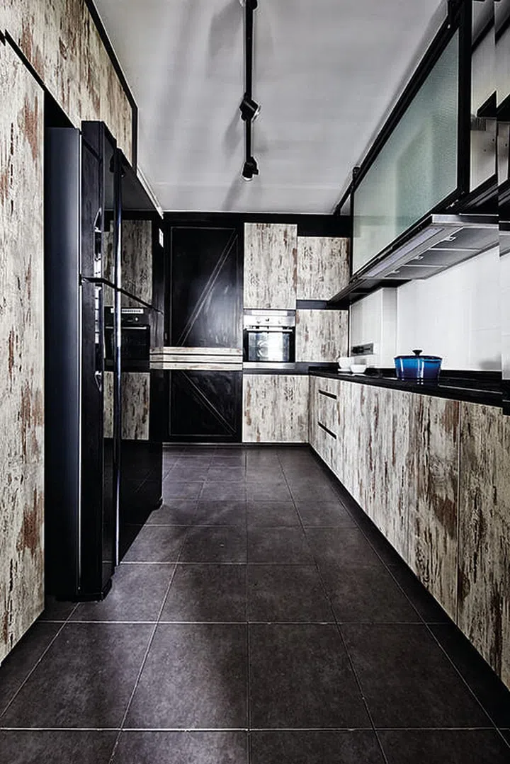 The key elements of the home - raw and rustic wood and metal textures - extend to the design of the kitchen.