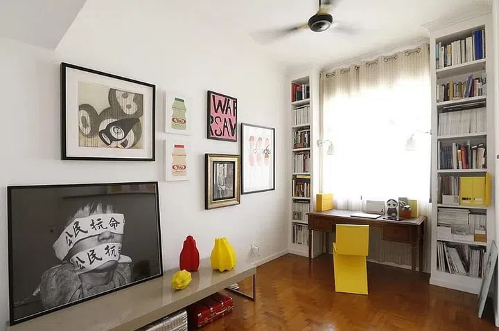 Study room in art gallerist Lim Ju Lynn's all-white 3-bedroom Bukit Timah condominium filled with art.