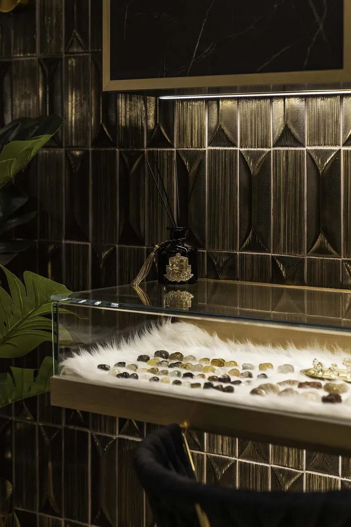 A crystal and gemstone collections are displayed exquisitely in custom fur-lined glass cases and wall-mounted storage cabinets in a banking couple's 3-bedroom condominium in West Coast.