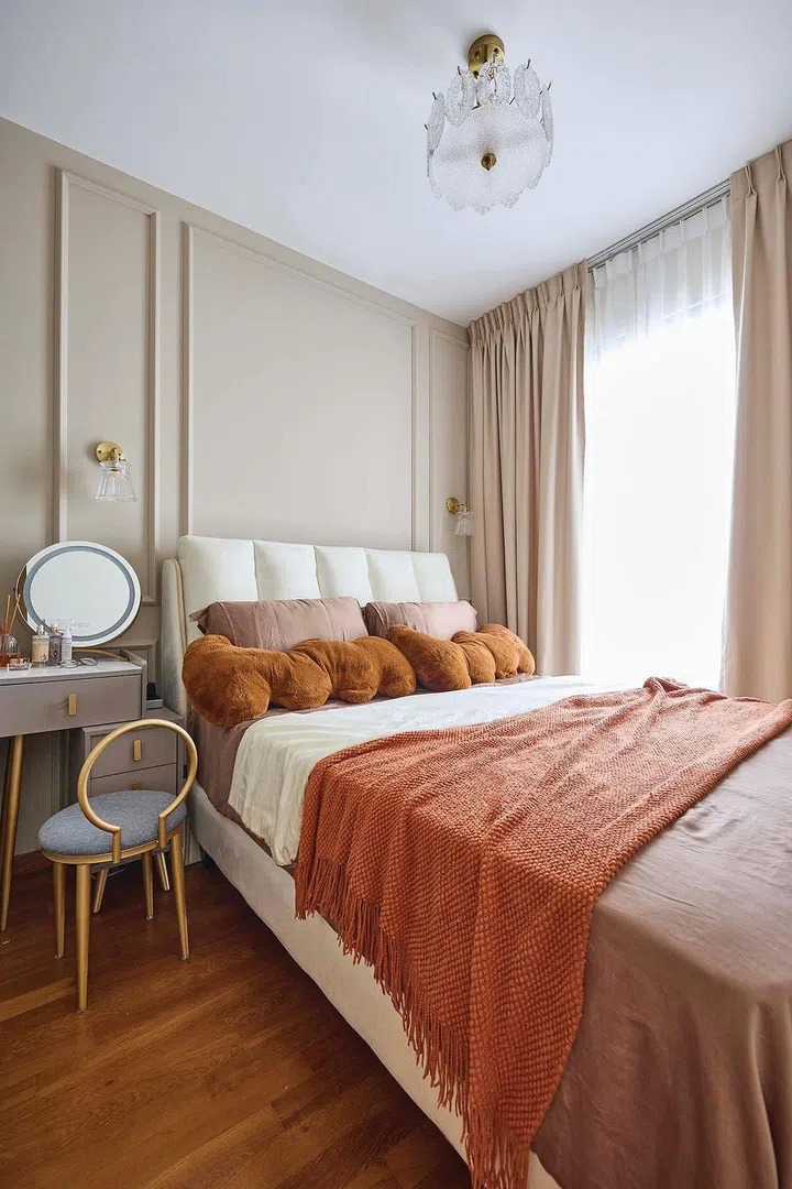 Deep, earthy terracotta brown bedsheets and throw line the bed in interior designer Vivian Chen (of Muwu Construction) and financial advisor husband, Michael Chan's 635 sq ft 2-bedroom condominium along Stirling Road.