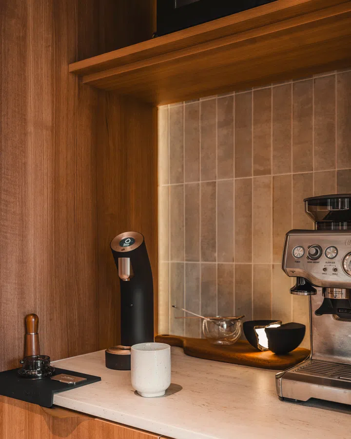 Thoughtfully planned shelving and counter depth ensure that even the smallest daily routines feel effortless in a compact home.