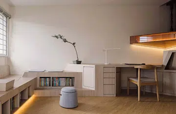 The laminate for the mid-landing display shelf and entrance cabinet was selected to match the existing teakwood. To balance the strong colours, a lighter toned laminate was used for the rest of the carpentry in the study and reading area.