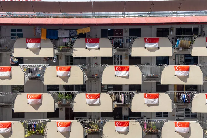 Singapore flags hang on the HDB housing flat to celebrate Singapore National Day.