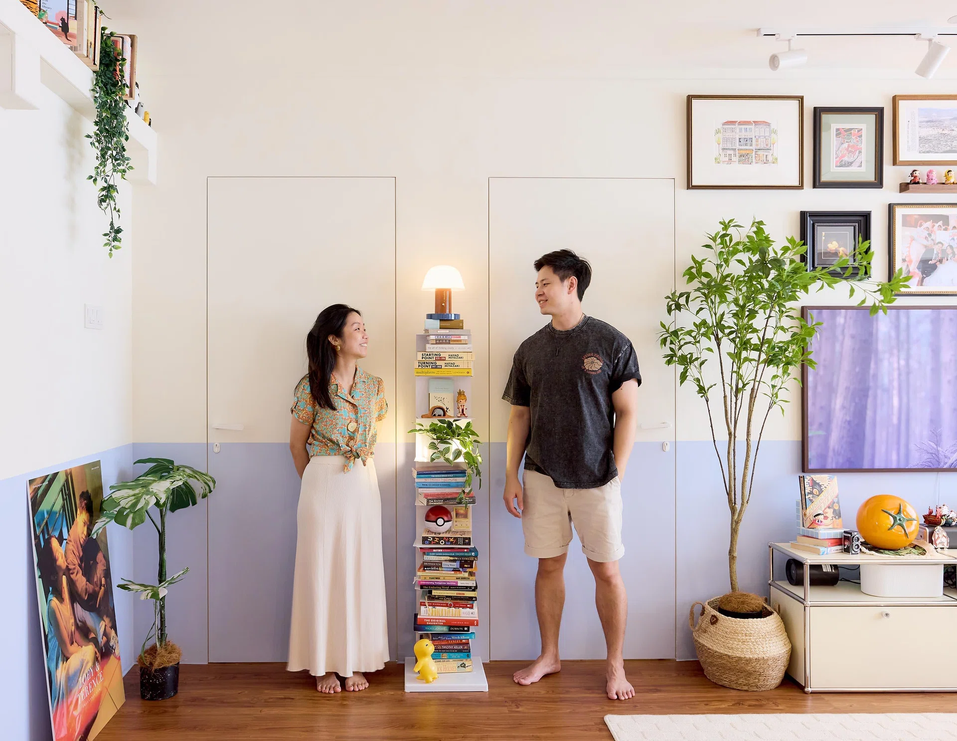 Homeowners Terence Chua and Zoey Lee pose for a photo in their 5-room HDB flat in Yishun, designed by Homely Matters Pte Ltd.