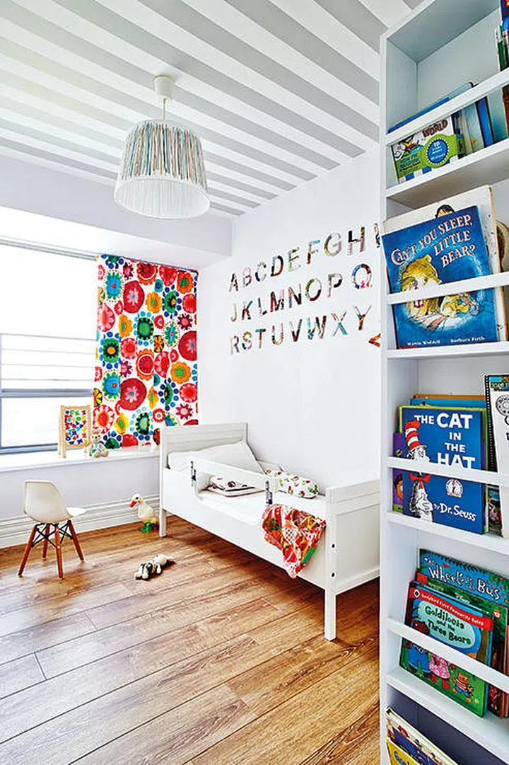 Simple grey and white stripes truly set this all-white room apart. Interior design by JQ Ong/The Association.