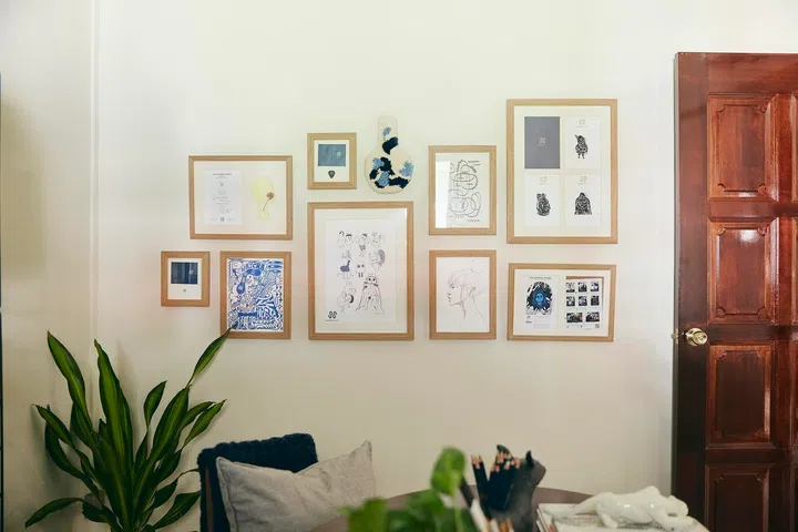 Works by artist friends and Hermsie’s own sketches form an ever-growing wall of creative memories.