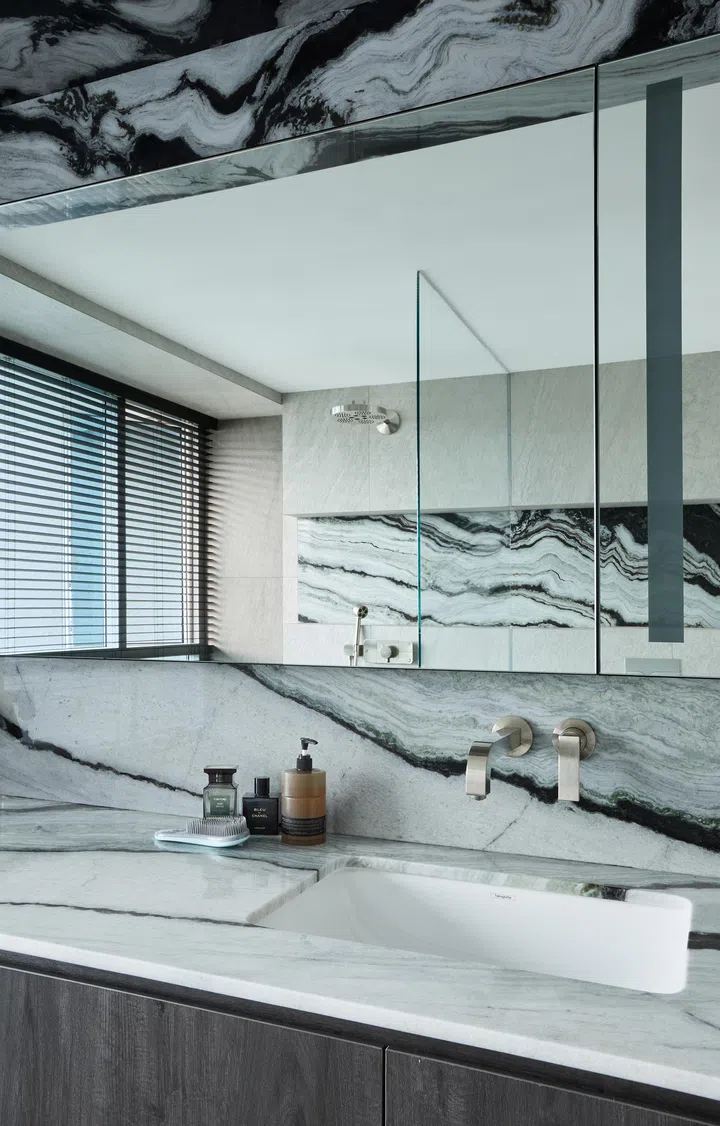 Master bathroom’s vanity is decked out in the same marble used across the house.