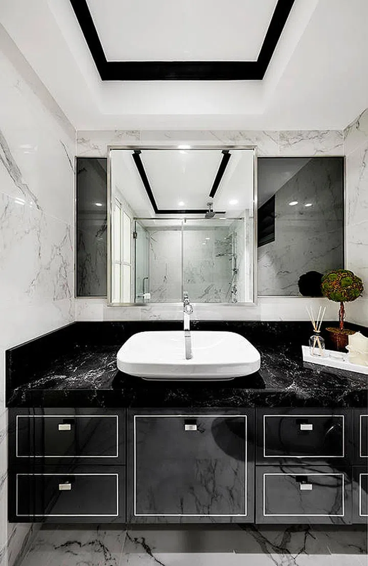 Doesn't this look like a glitzy hotel bathroom? It actually belongs to a five-room HDB flat in Punggol. Interior design by Akihaus.
