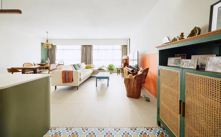 Their spacious living room is flooded in natural lighting, brightening up the space. 