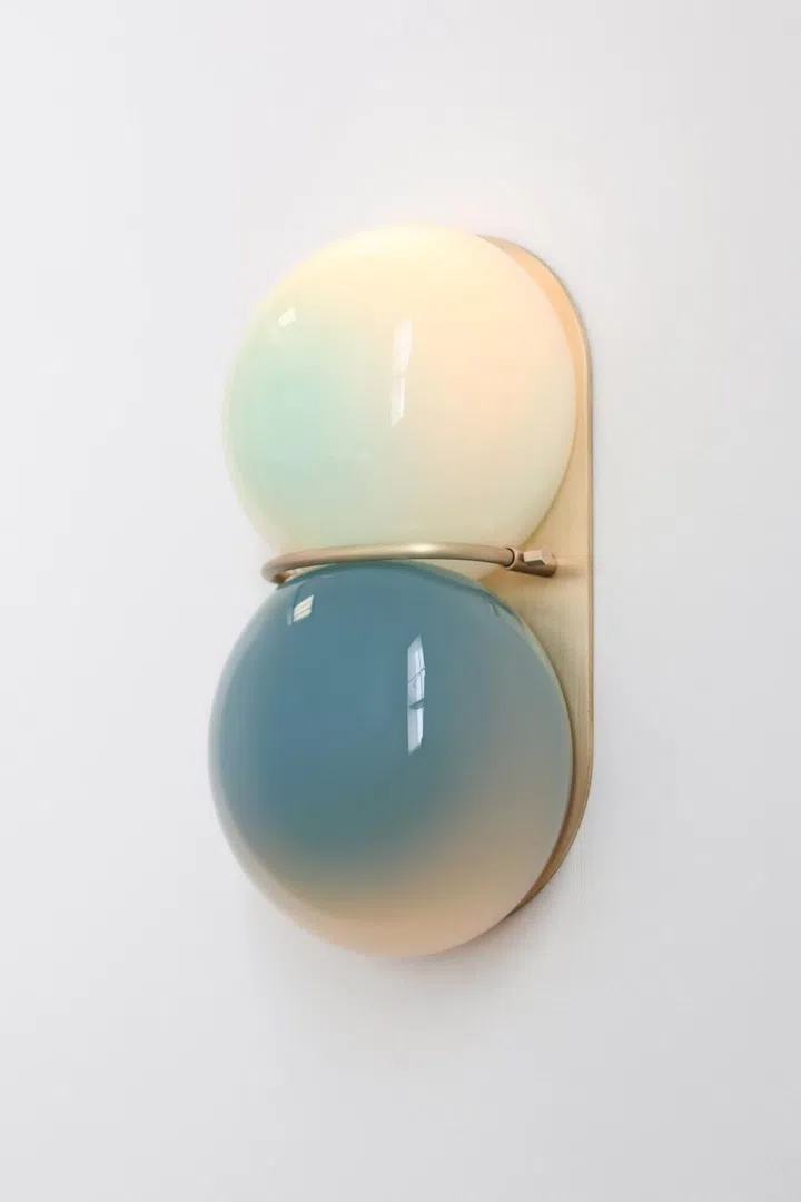 SkLO Twin Sconce Wall Lamp ($2,699) comes in a pendant ceiling lamp option, too ($3,999).