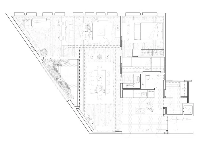Floor plan of the flat, showing how the acute-angled corner shapes the dining, living and balcony zones.