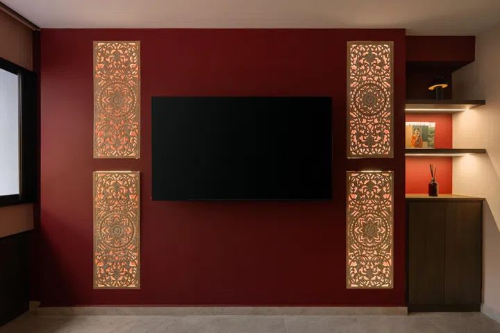 Deep maroon walls and illuminated carved panels create a warm, calming retreat designed especially for Amir’s mother.