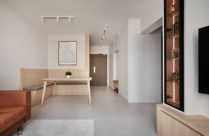 A custom shoe cabinet with a built-in settee makes the entryway both practical and welcoming.