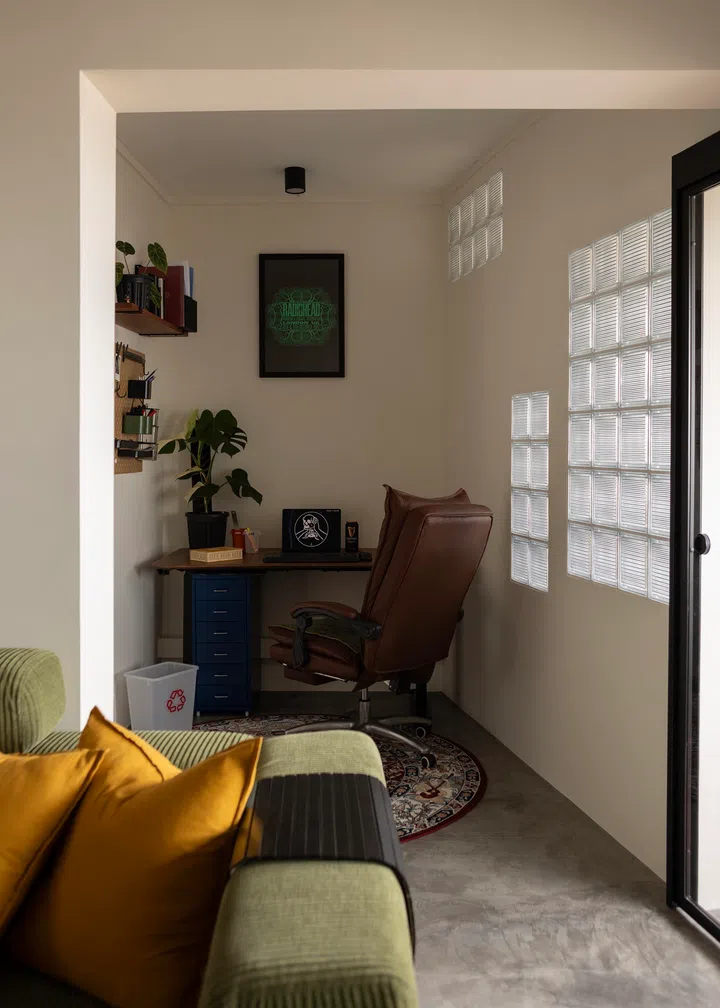 A study corner fits snugly by the living room.