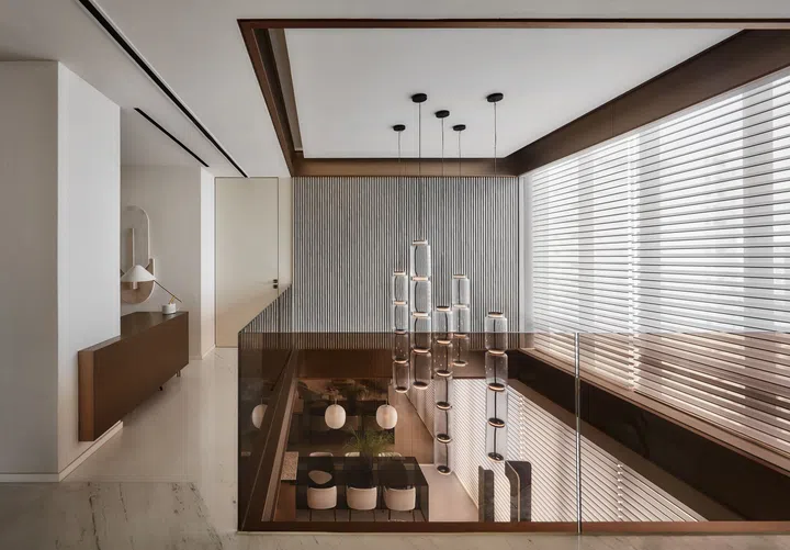 Extending the second storey footprint over the void above the existing private lift lobby allows for the addition of a home office.