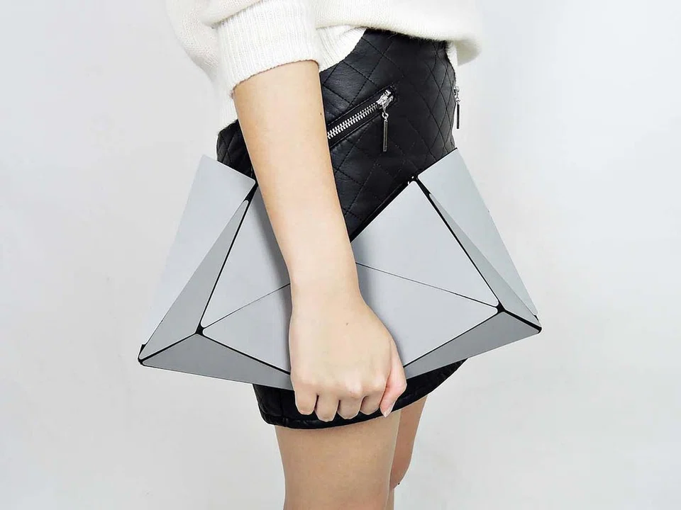 The Transformation
bag was inspired by folded geometric shapes.