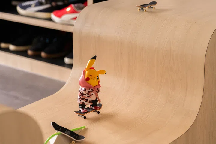 The children need no invitation to race fingerboards along the skate-ramp-inspired curves.