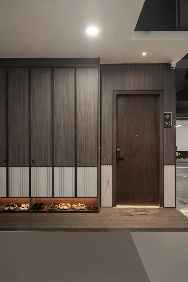 Viewed from the carpark, the home’s private basement entrance was designed with the same attention to material continuity and concealed storage seen throughout the interior.