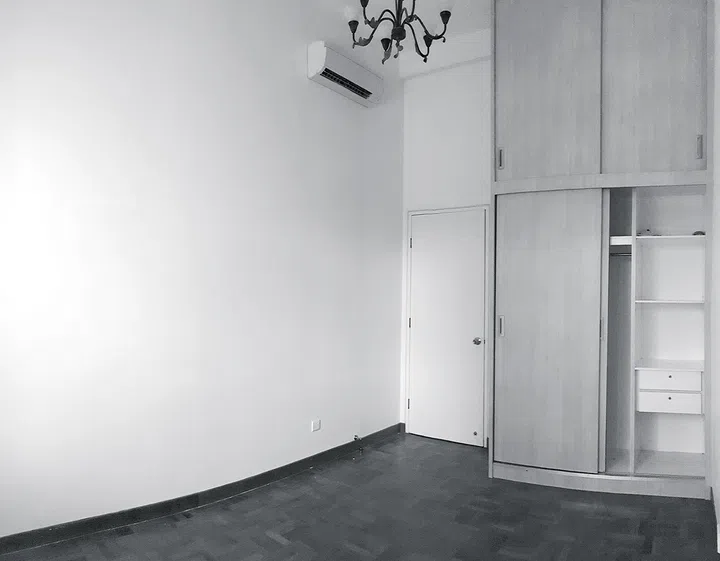 Master bedroom with wardrobe before renovation in a 3-bedroom condo in East Coast.