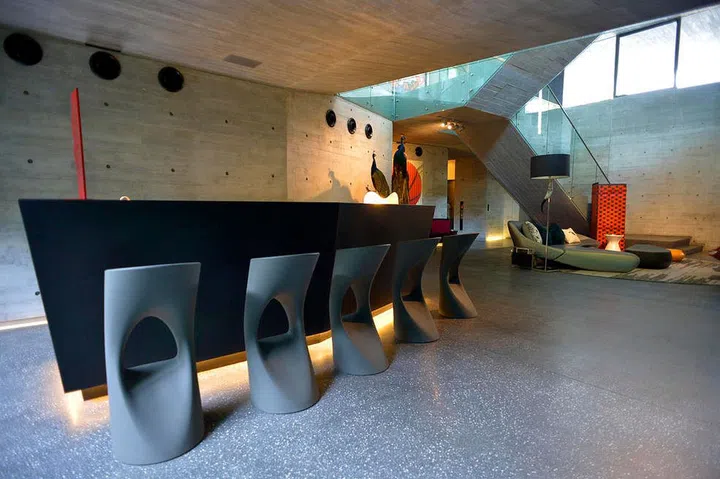 A series of Flod barstools by Spanish label Mobles 114 decorate the home bar of socialite Susanna Kang’s Sentosa Cove home.