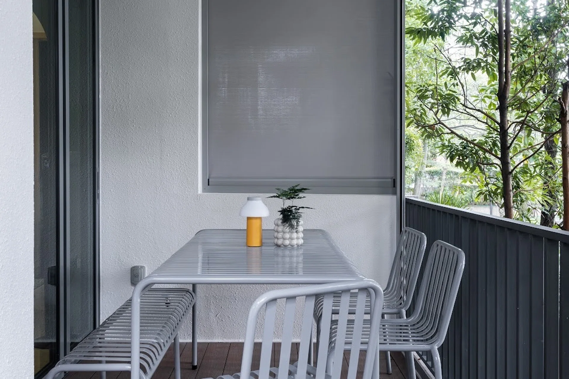 Homeowner Nicholas’ outdoor balcony in central Singapore with a 10-seater dining table.