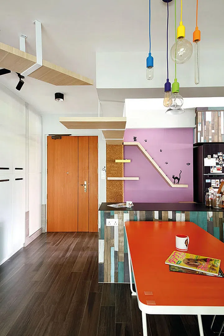 Part of the kitchen wall was torn down to “open up” the kitchen space. A structural pillar here is wrapped in thick hemp rope, which prevents the cats from scratching its surface.