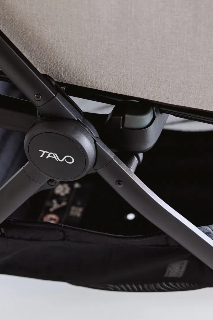 Quick release button on the Tavo pet stroller.