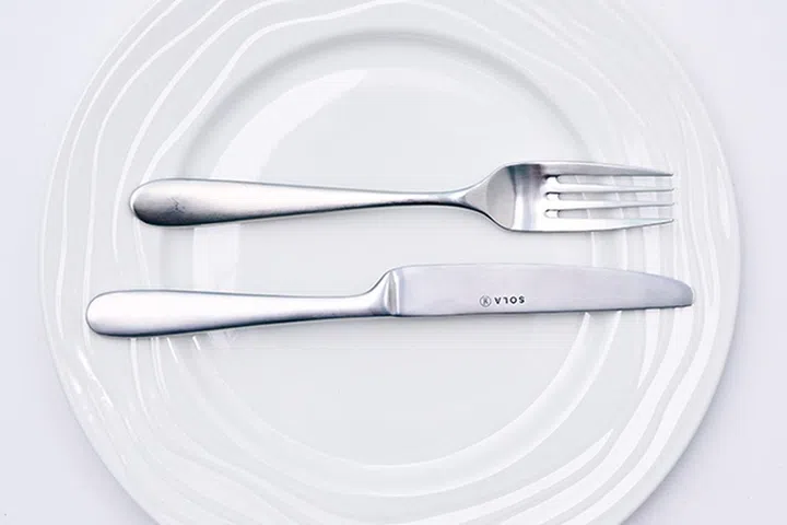 Utensils placed parallel to you, facing the right, signal to waiters that the dish was excellent.