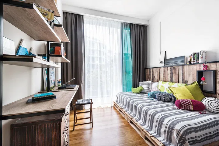 Homeowner Simon asked for open shelves to display his quirky home accessories, so a backless one was customised for the bedroom. “It’s nice because you can still see the wall behind the shelves, which makes it look lighter,” he says.