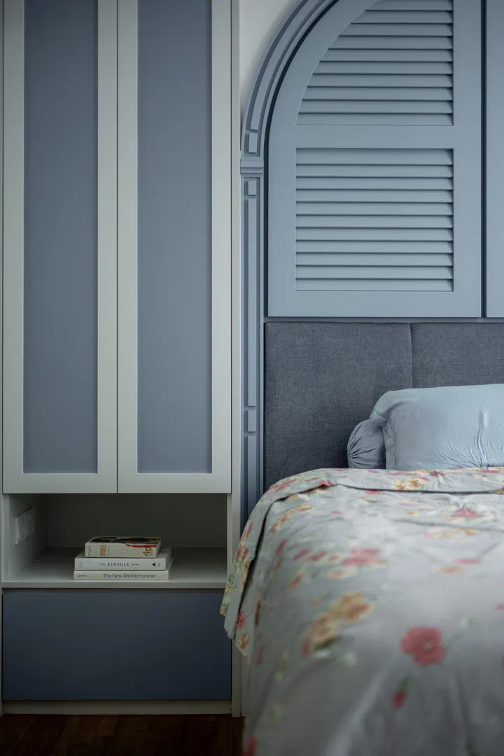 A gentle step-up floor leading to the bed subtly marks the transition from activity to rest.