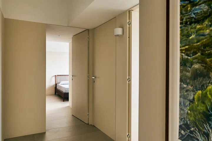 A wider, open corridor replaces the typical, narrow HDB corridor that leads to the bedrooms.