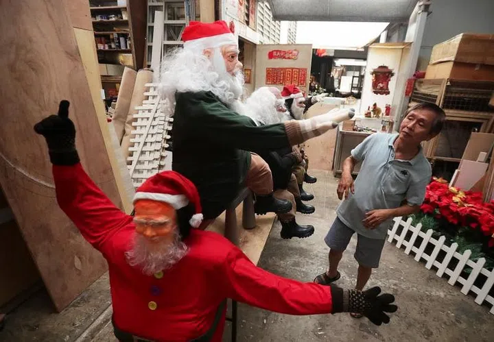 Seven colourful dwarfs alongside seven cabins with snow-capped roofs in a Woodlands neighbourhood are seeking their princess this Christmas created by resident Tan Koon Tat who live at Block 178 Woodlands Street 13. ST Photo
