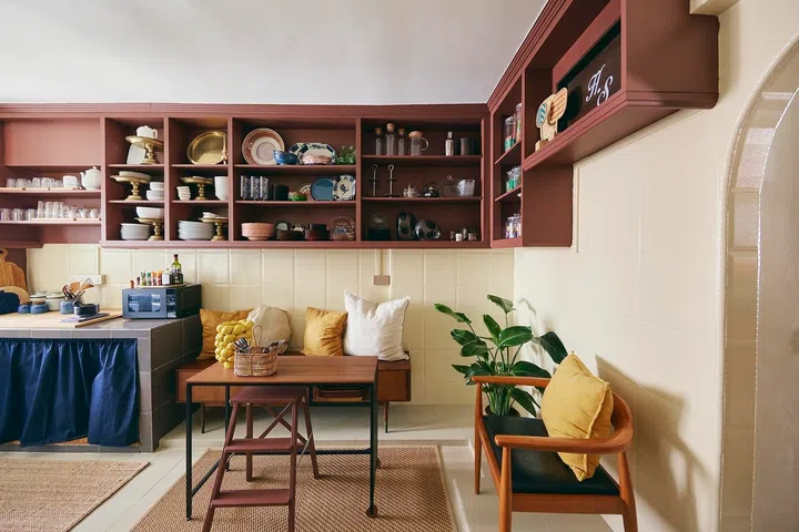 The kitchen functions less as a cooking space than another gathering place for slow conversations.