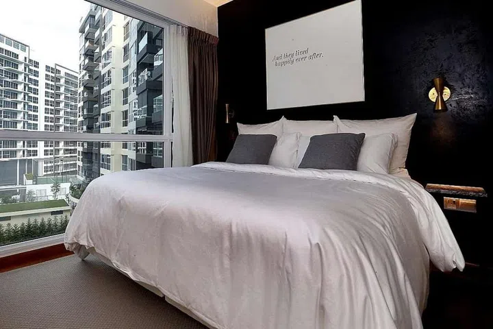 The black wall in the bedroom - the couple opted for the colour as a contrast to the other white walls so the room looks "chic and clean"