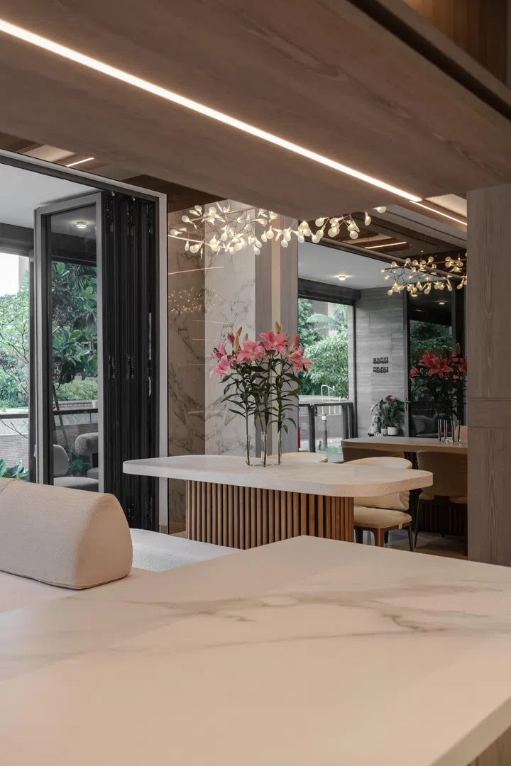 The living room, dining area, and patio were designed to flow as one connected entertaining space, allowing guests to move comfortably between zones during larger gatherings.