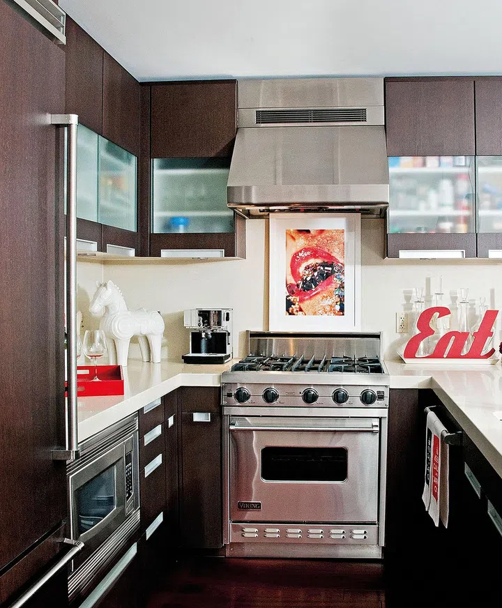 A kitchen with artwork and sculptures