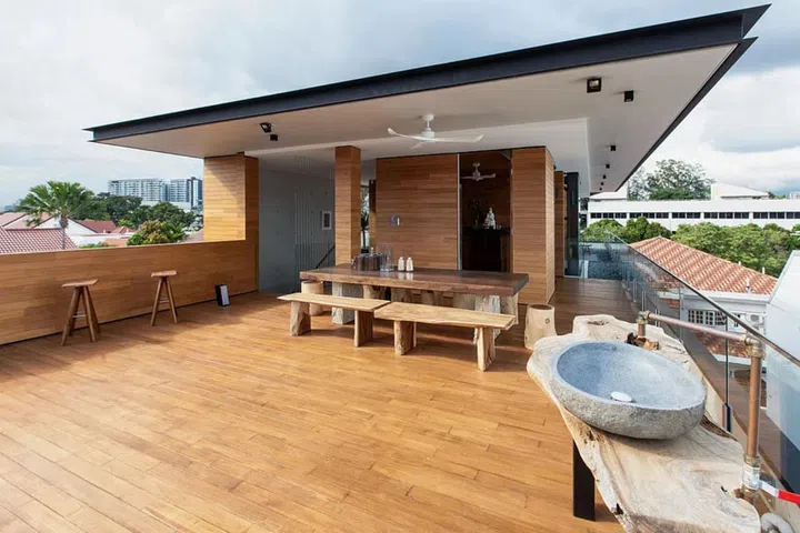 A large deck stretches across the top floor, where the family sometimes has barbecues.