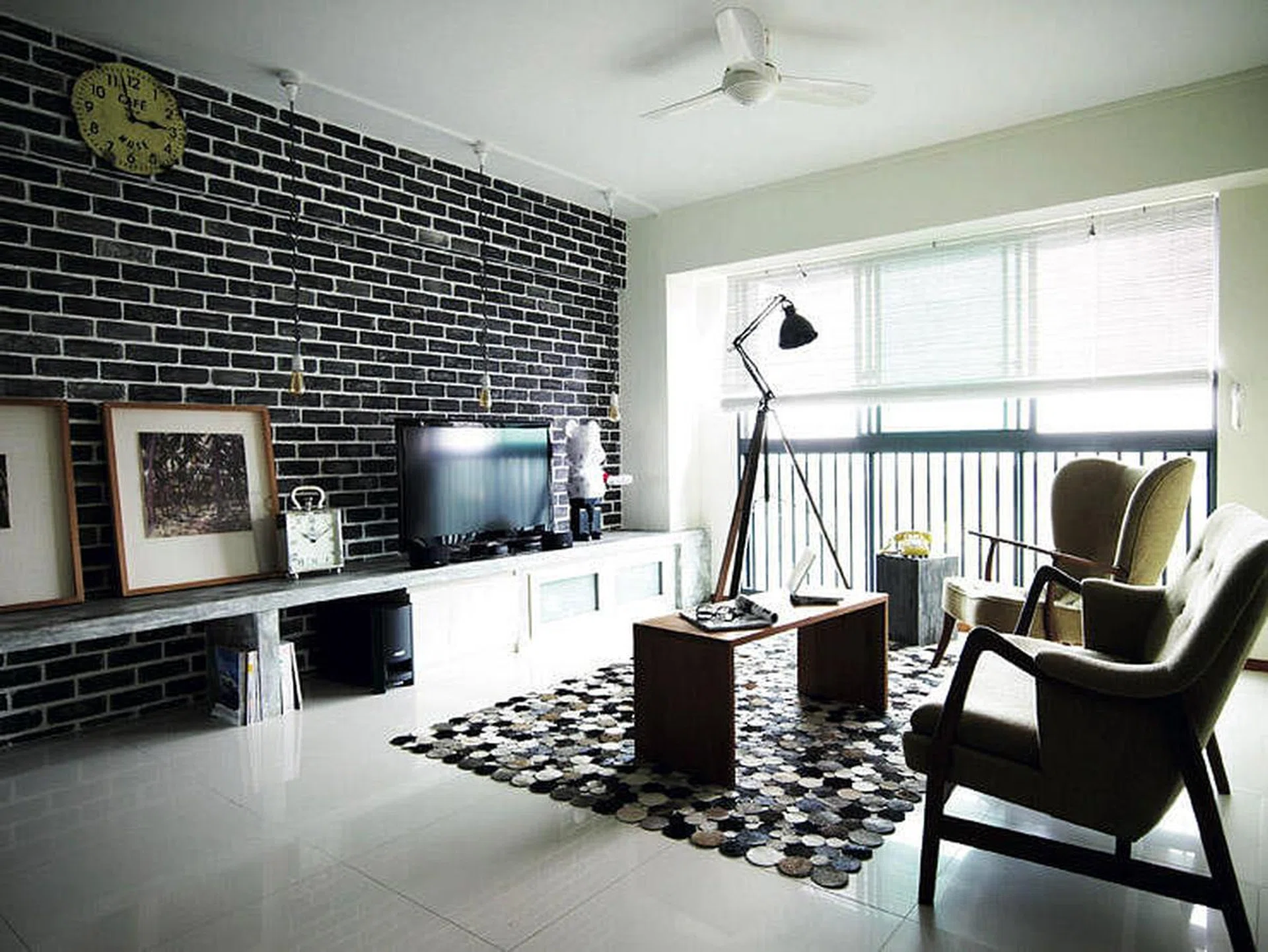 The original salmon-coloured wall was redone in a darker shade for a cooler, more industrial look and the result is a meticulously painted faux brick wall.