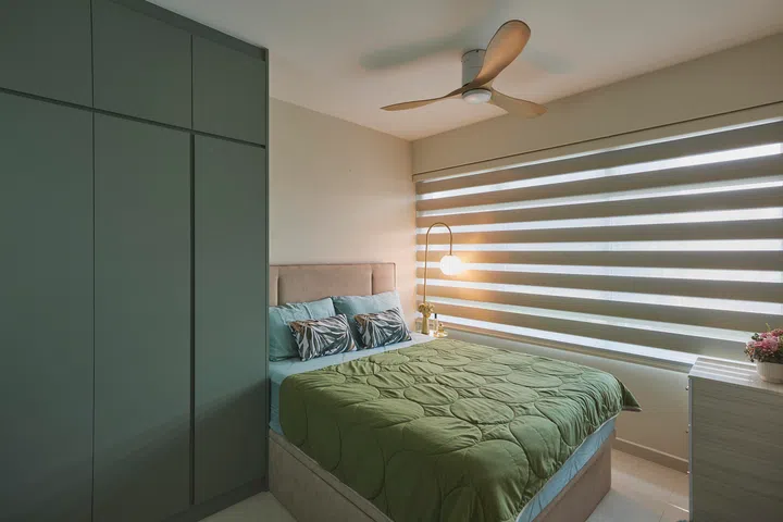 Soft sage wardrobe carpentry in the master bedroom continues the calm, restful palette carried throughout the home.
